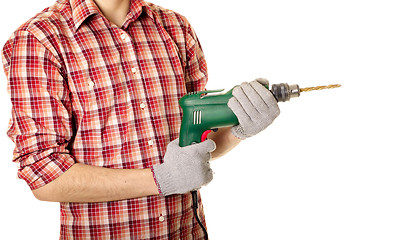 Image showing hands handling an electric drilling machine