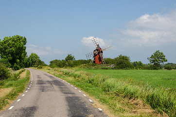 Image showing Old windmill by roadside