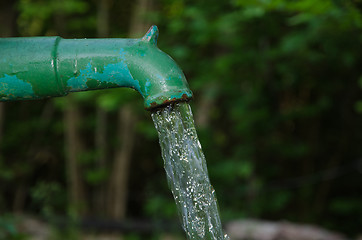 Image showing Splashing water from a farm pump