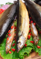 Image showing fish on plate with red pepper