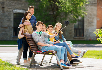 Image showing happy teenage students taking selfie by smartphone