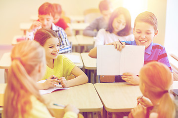 Image showing group of school kids writing test in classroom