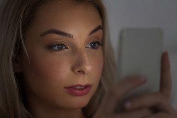 Image showing young woman with smartphone at night