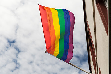 Image showing close up of rainbow gay pride flag waving on building