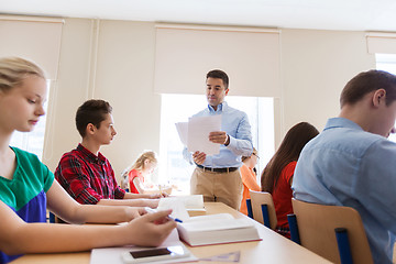 Image showing group of students and teacher with test results