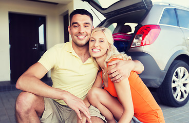 Image showing happy couple hugging at home car parking space