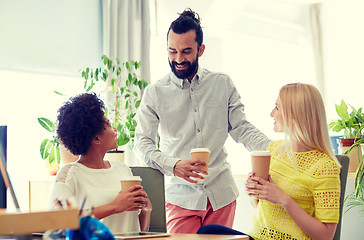 Image showing happy creative team drinking coffee in office