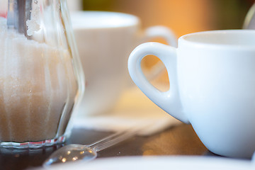 Image showing cup with tea, spoon and sugar