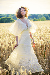 Image showing Beautiful smiling woman dancing on the summer Field