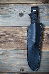 Image showing hunting knife in a leather scabbard