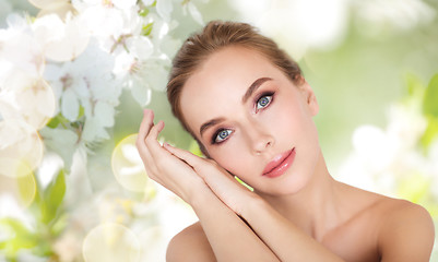 Image showing beautiful young woman face and hands