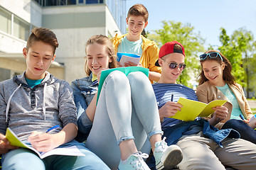 Image showing group of students with notebooks at school yard