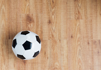 Image showing close up of football or soccer ball on wood