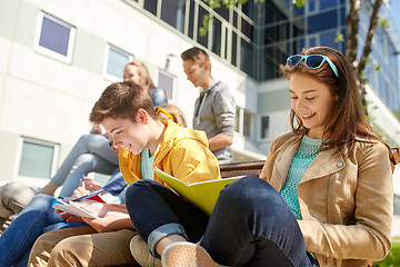 Image showing group of students with notebooks at school yard