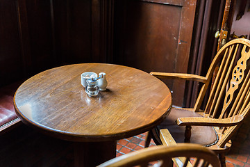 Image showing close up of vintage table and chairs in irish pub