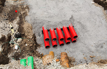 Image showing close up of pipes sticking out ground