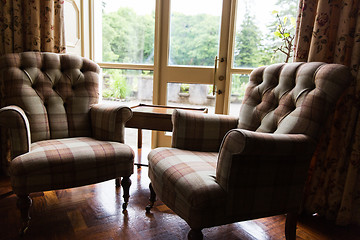 Image showing close up of vintage armchairs and table in hotel