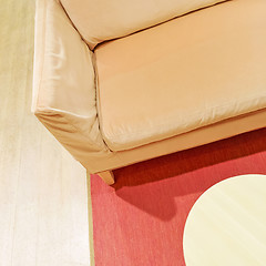 Image showing Pink velvet sofa and wooden coffee table