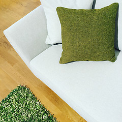 Image showing White sofa with green cushion