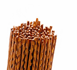 Image showing salted pretzel sticks isolated on white