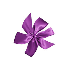 Image showing purple gift ribbon with bow isolated on white background