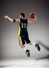 Image showing Full length portrait of a basketball player with ball