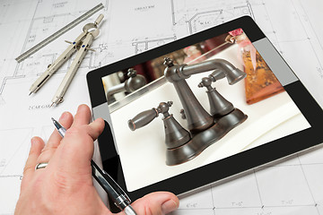 Image showing Hand of Architect on Computer Tablet Showing Bathroom Details Ov