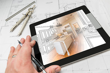 Image showing Hand of Architect on Computer Tablet Showing Kitchen Illustratio