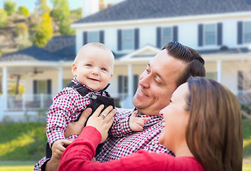 Image showing Baby Having Fun With Mother and Father Out Front