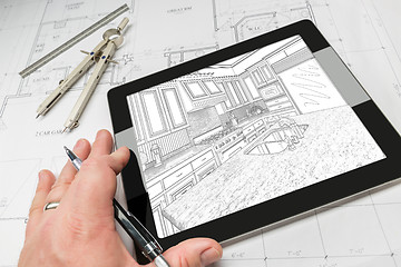 Image showing Hand of Architect on Computer Tablet Showing Kitchen Illustratio