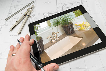 Image showing Hand of Architect on Computer Tablet Showing Bathroom Details Ov