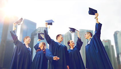 Image showing group of smiling students with mortarboards
