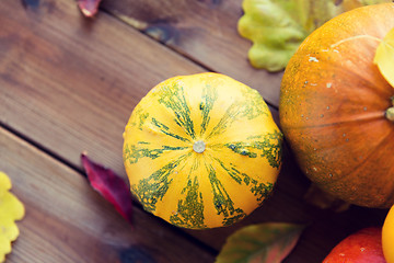 Image showing close up of pumpkins on wooden table at home