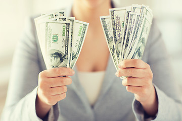 Image showing close up of woman hands holding us dollar money