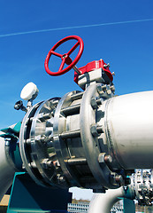 Image showing Industrial zone, Steel pipelines and valves against blue sky