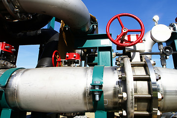 Image showing Industrial zone, Steel pipelines and valves against blue sky