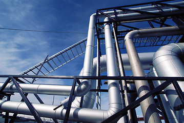 Image showing Industrial zone, Steel pipelines and valves against blue sky