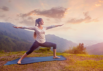 Image showing Woman doing Ashtanga Vinyasa Yoga asana Virabhadrasana 2 Warrior