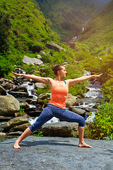 Image showing Woman doing Ashtanga Vinyasa Yoga Virabhadrasana 2 Warrior pose 