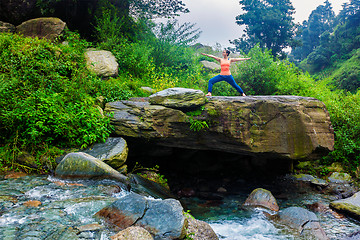 Image showing Woman doing Ashtanga Vinyasa Yoga Virabhadrasana 2 Warrior pose 