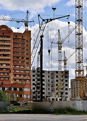 Image showing  Construction site with cranes on sky background