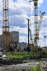 Image showing  Construction site with cranes on sky background