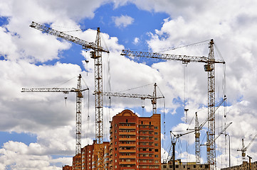 Image showing  Construction site with cranes on sky background