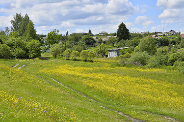 Image showing Rural landscape with road and houses flowering meadow