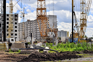 Image showing  Construction site with cranes on sky background