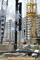 Image showing Mechanism scores piles at construction site