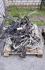 Image showing Metal waste, lie on a wooden pallet warehouse on the open industrial waste