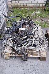 Image showing Metal waste, lie on a wooden pallet warehouse on the open industrial waste