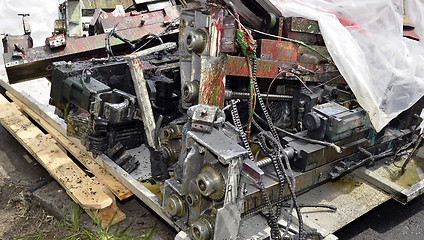 Image showing Metal waste, lie on a wooden pallet warehouse on the open industrial waste