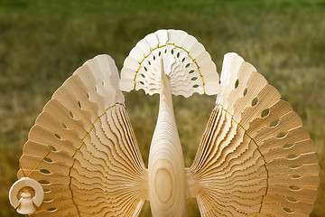 Image showing The figure of a fabulous bird made of wood.